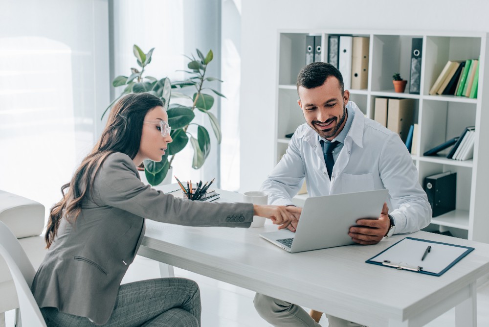 man and woman using medical transcription service in office setting