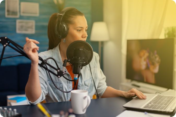 woman creating podcast transcription using speech to text on laptop