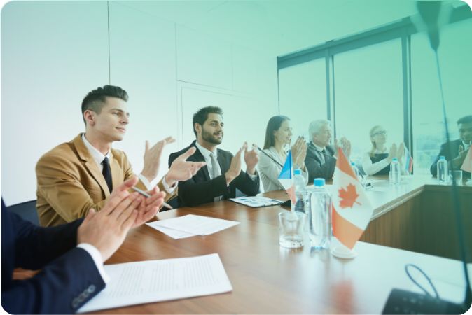 Politicians applauding at meeting in a meeting room