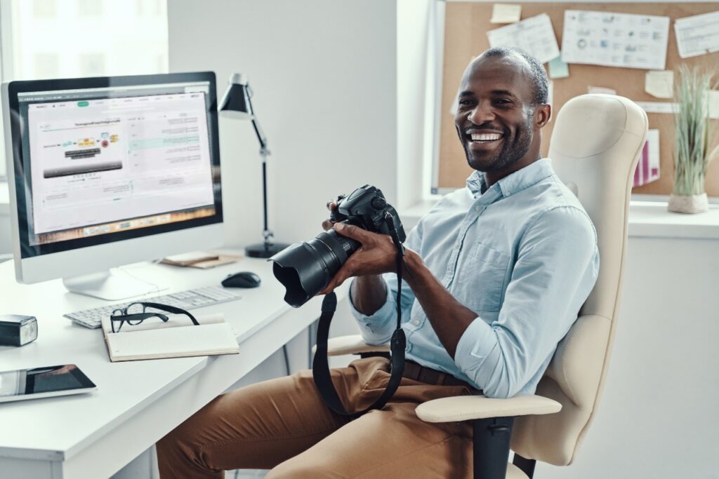black man sitting and doing his job remotely